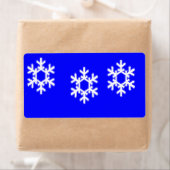 Witte sneeuwvlokken op blauw etiket (Insitu)