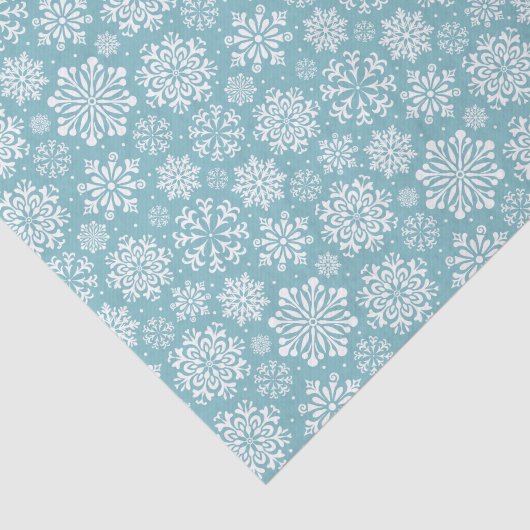 Witte sneeuwvlokken op blauw kerstfeest tissuepapier (Detail)
