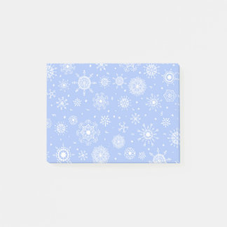 Witte sneeuwvlokken op blauw post-it® notes