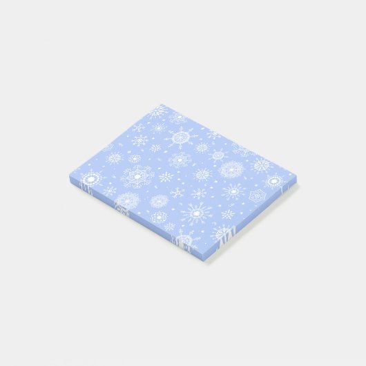 Witte sneeuwvlokken op blauw post-it® notes (Schuin)