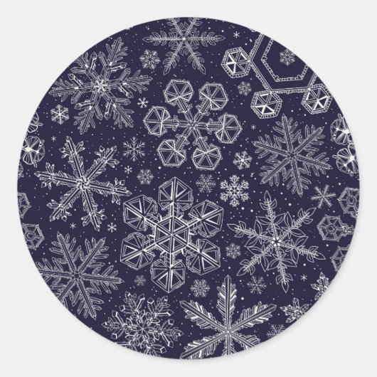 Witte sneeuwvlokken op blauw ronde sticker (Voorkant)