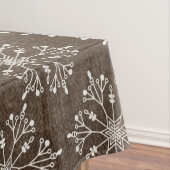 Witte sneeuwvlokken op bruine tablet tafelkleed (Voorbeeld)