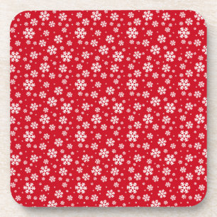 Witte sneeuwvlokken op een rood winterpatroon bier onderzetter