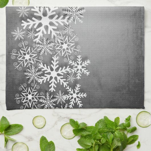 Witte sneeuwvlokken op grijze keukenhanddoeken (Gevouwen)