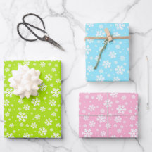 Witte sneeuwvlokken op groen, blauw en roze