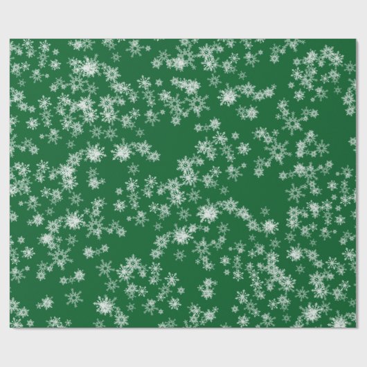 Witte sneeuwvlokken op groenboek cadeaupapier (Vlak)