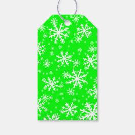Witte sneeuwvlokken op limoengroen cadeaulabel