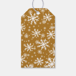 Witte sneeuwvlokken op mat goud cadeaulabel