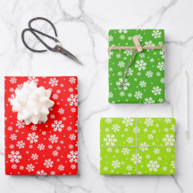 Witte sneeuwvlokken op rood en groen