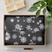 Witte sneeuwvlokken op zwart papier (Geschenk)