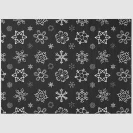 Witte sneeuwvlokken op zwarte kerst tissuepapier