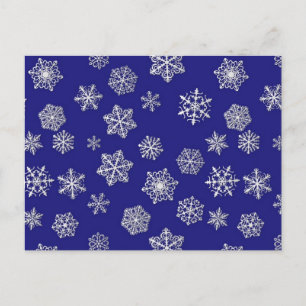 Witte sneeuwvlokken tegen diep kobalt blauw briefkaart