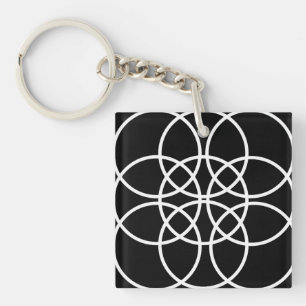 Witte spiraalvormige cirkels sleutelhanger