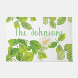 Witte ventilator en groene lederen tuin deurmat