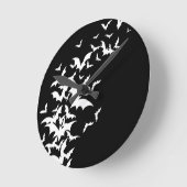 Witte vlekken op zwart ronde klok (Hoek)