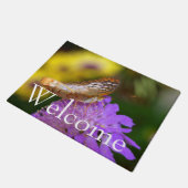 Witte vlindervlinder op paarse bloei deurmat (Schuin)