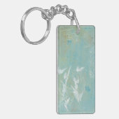 Witte vogels vliegen door de blauwe hemel sleutelhanger (Voorkant Links)