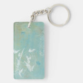 Witte vogels vliegen door de blauwe hemel sleutelhanger (achterkant)