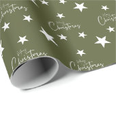 Witte vrolijke kerststerren op groen cadeaupapier (Rol Hoek)