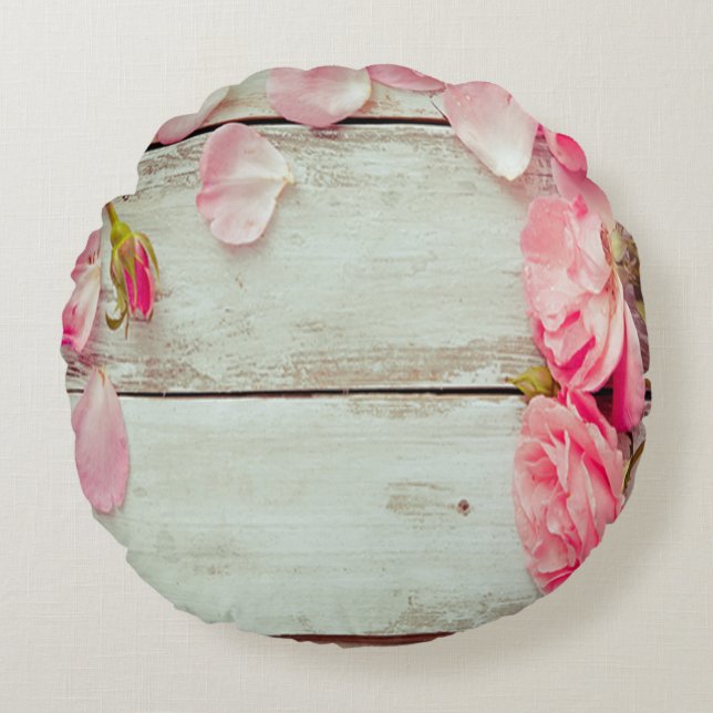  witte wand roze rozen, grijs rond kussen (Voorkant)