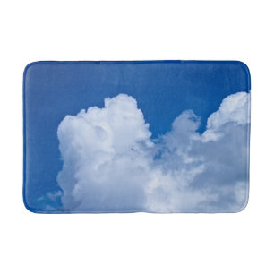 Witte wolken in de blauwe lucht badmat