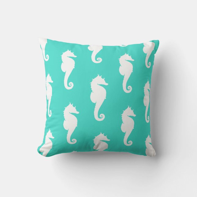 Witte zeepaarden op turquoise kussen (Voorkant)