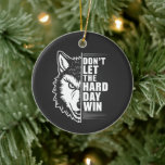 Wolf Don't Let The Hard Day Win Quote Art Keramisch Ornament<br><div class="desc">A powerful minimalist design featuring a sharp wolf profile paired with the motivational quote “Don’t Let The Hard Day Win.” The bold black and white contrast creates a striking visual that symbolizes resilience, strength, and determination. With its clean graphic style and intense wolf imagery, this artwork is perfect for those...</div>