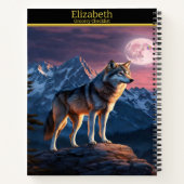 Wolf huilt onder een maanverlichte hemel notitieboek (Achterkant)