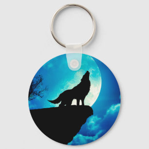 Wolf in silhouette die naar de volle maan kijkt sleutelhanger