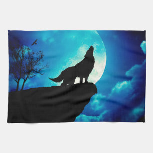 Wolf in silhouette die naar de volle maan kijkt theedoek
