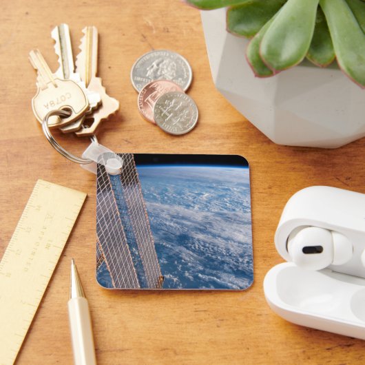 Wolk-bedekte Tasman en koraal Zeeen. Sleutelhanger (Bureau)