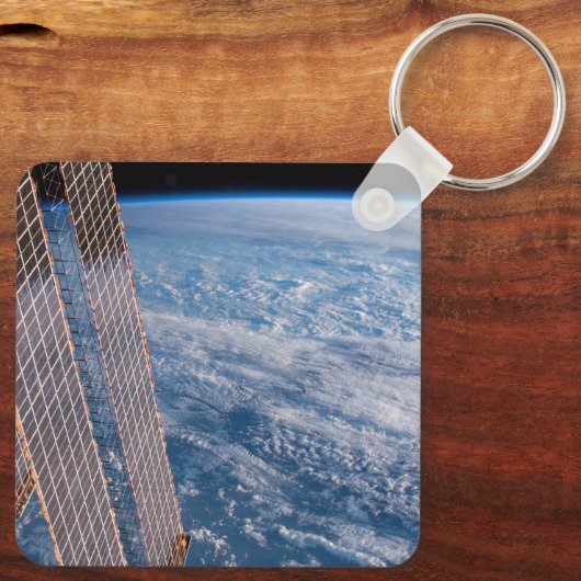 Wolk-bedekte Tasman en koraal Zeeen. Sleutelhanger (Achterkant)