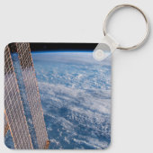 Wolk-bedekte Tasman en koraal Zeeen. Sleutelhanger (Achterkant)