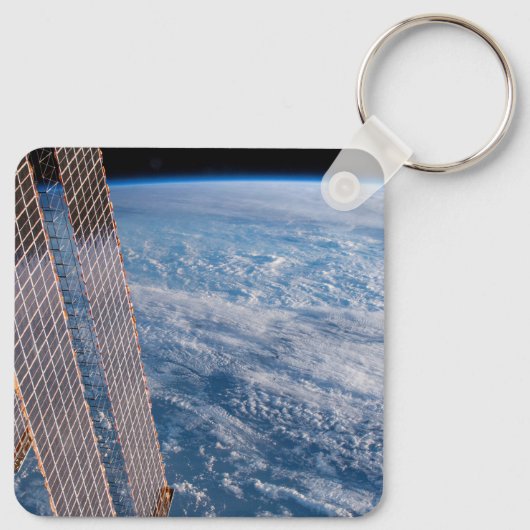 Wolk-bedekte Tasman en koraal Zeeen. Sleutelhanger (Achterkant)