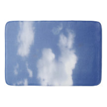 wolk in blauwe lucht badmat