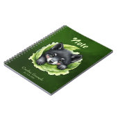 Wolvenwelp in het groen notitieboek (Linkerzijde)