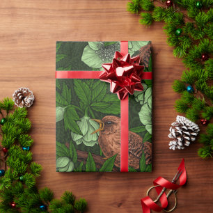 Wren en hellebore op donkergroen cadeaupapier