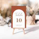Wuwelijk Lijst van terracotta-arch Kaart<br><div class="desc">Moderne en elegante vormgeving met een gedrukt Whimsical Arch Lijst Terracotta Burnt Script Wedding Table Number, dat kan worden aangepast met jouw tekst en elke tabelnummerkaart aan uw kar kan toevoegen, één voor één. Klik op de knop "Aanpassen" en gebruik onze ontwerptool om deze sjabloon te wijzigen. Bekijk de grafische...</div>
