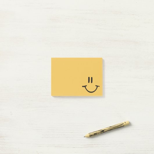Yellow Happy Face Post-it® Notes (Op bureau)