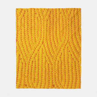 Yellow knitted surface textile material background fleece deken