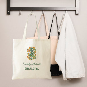 Yoga-houding wervelingen groene oranje naam slogan tote bag