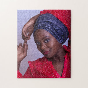Young African Lady met Blue Jeans Headwrap Legpuzzel