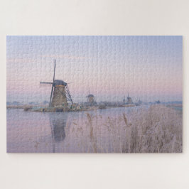 Zacht zonlicht in de winter boven windmolens legpuzzel