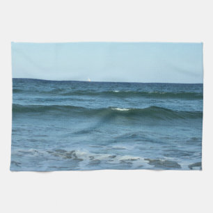 Zachte Blauwe Golven die naar de Kust Rollen Theedoek