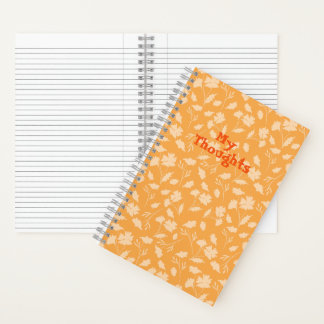 Zachte bloemenpatronen met een oranje achtergrond notitieboek