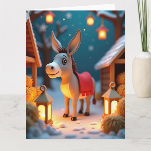 Zachte ezel in de besneeuwde kerststal kaart (Voorkant)