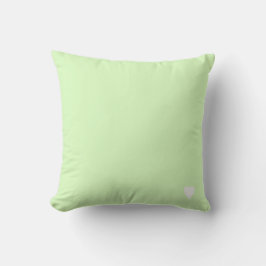Zachte limoengroene pastel effen kleur met hart kussen