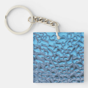 Zachte regendruppels op blauw glas sleutelhanger