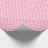 Zachte witte pootafdruk op roze cadeaupapier (Hoek)