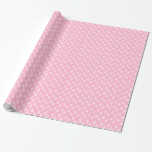 Zachte witte pootafdruk op roze cadeaupapier